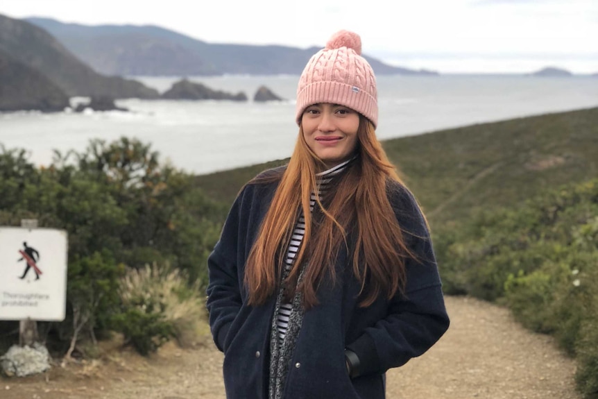 Spana Nakarmi poses on a walking trail.