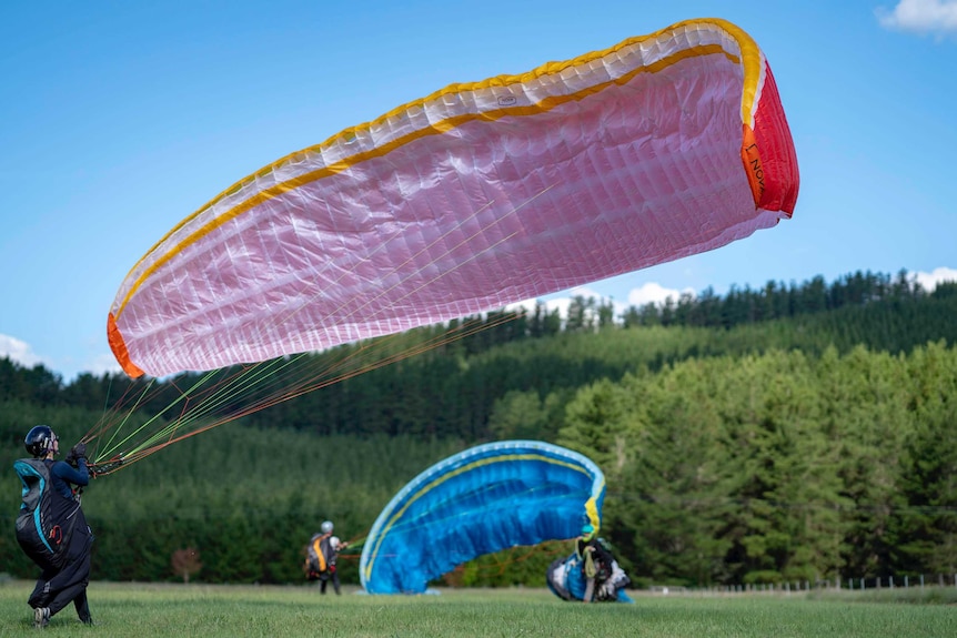 Paragliders about to take off