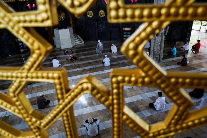 Muslims sitting in a mosque during the first day of holy fasting month of Ramadan.