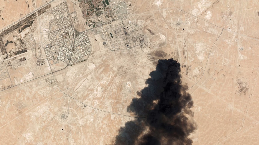 satellite image of Saudi processing oil plant showing a huge black smoke cloud