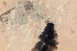 satellite image of Saudi processing oil plant showing a huge black smoke cloud