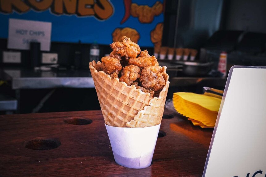Southern fried popcorn chicken served in a waffle cone