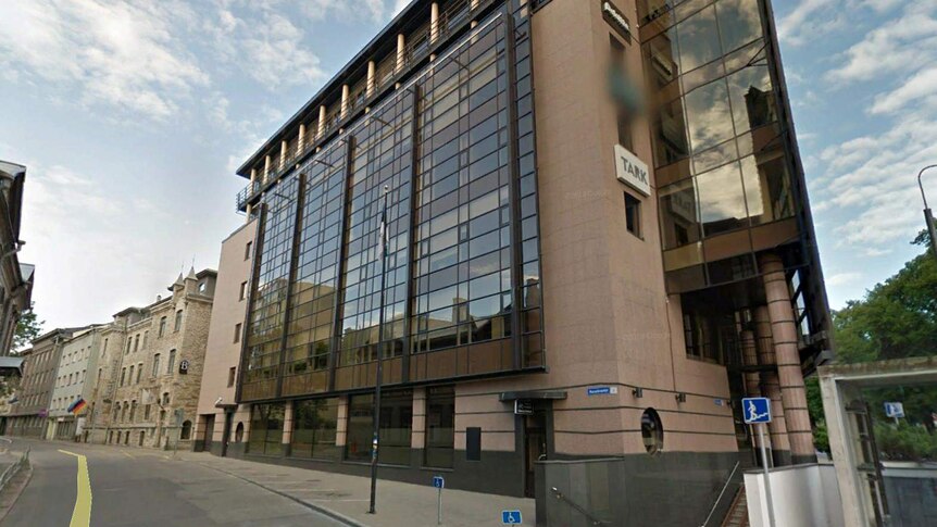 A Google Street View picture of a brown office building.