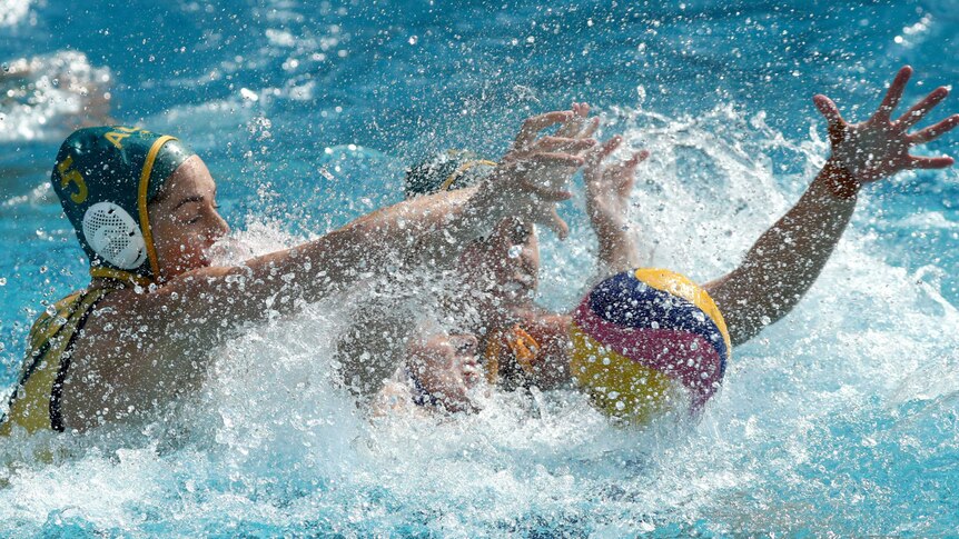Australia's Keesja Gofers and Russia's Anna Grineva battle for ball in Olympic women's water polo.