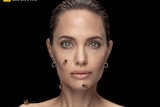 Angelina Jolie with bees crawling on her torso and face.