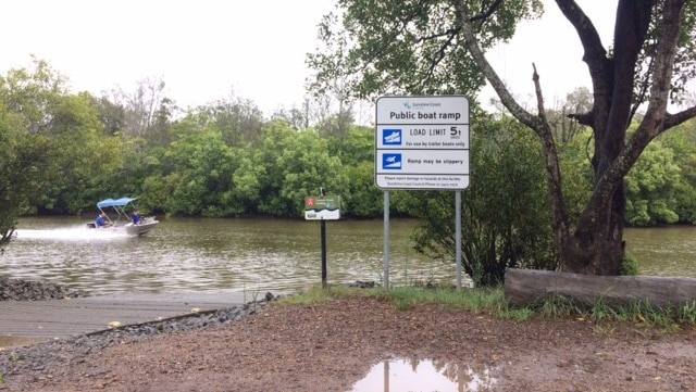 Signs near Coolum Creek warming about crocodiles.