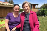 Francie Korotki stands with a carer in the community garden at Dodges Ferry