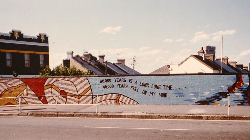 Indigenous street art mural opposite Redfern station with the words "40 000 years is a long time, 40 000 years is on my mind"