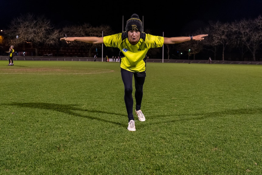 an umpire signals holding the ball