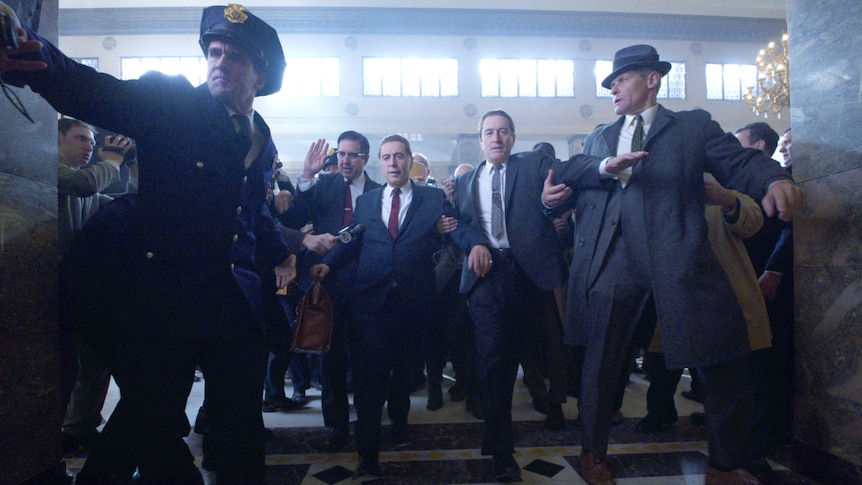Robert De Niro and Al Pacino in suits in a scene set in the 50s from the film The Irishman