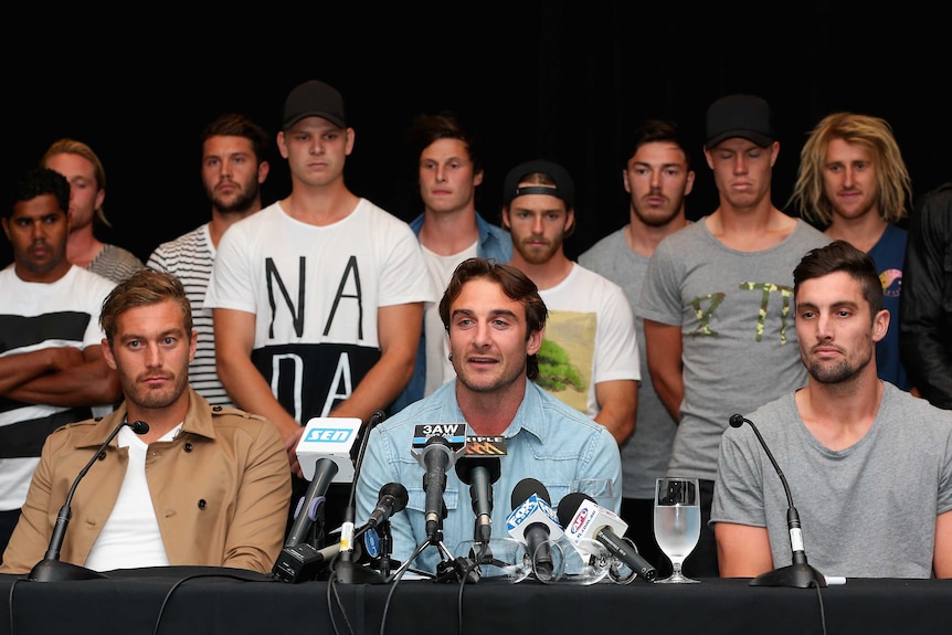 Jobe Watson (C) speaks for past and present Essendon players after not guilty doping verdict.