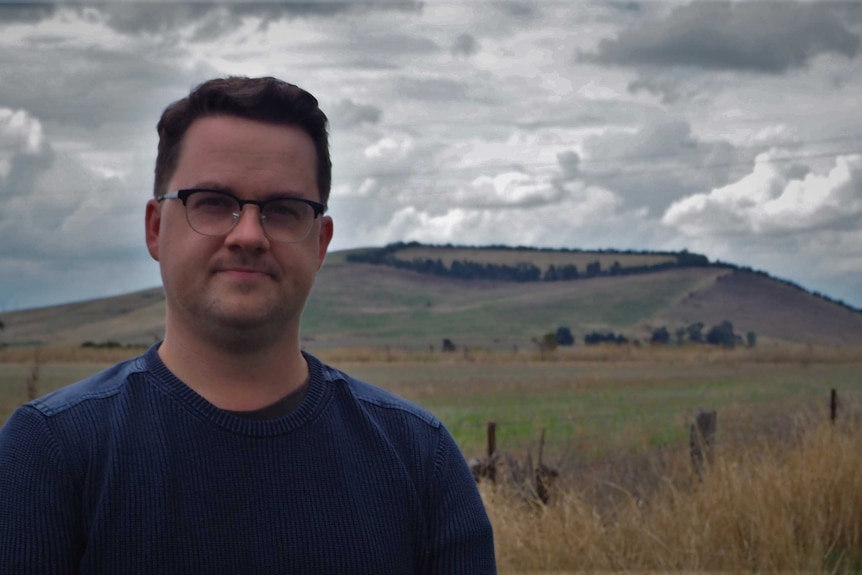 Western Victorian historian Ben Wilkie in front of Weatherboard Hill, a large scoria cone near Ballarat.