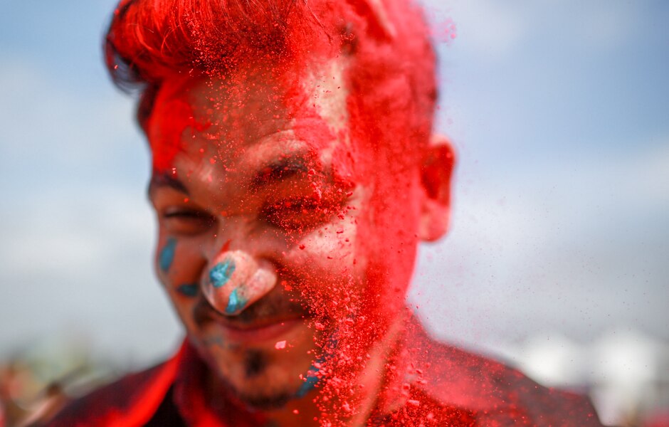 Guri Singh covered in coloured powder