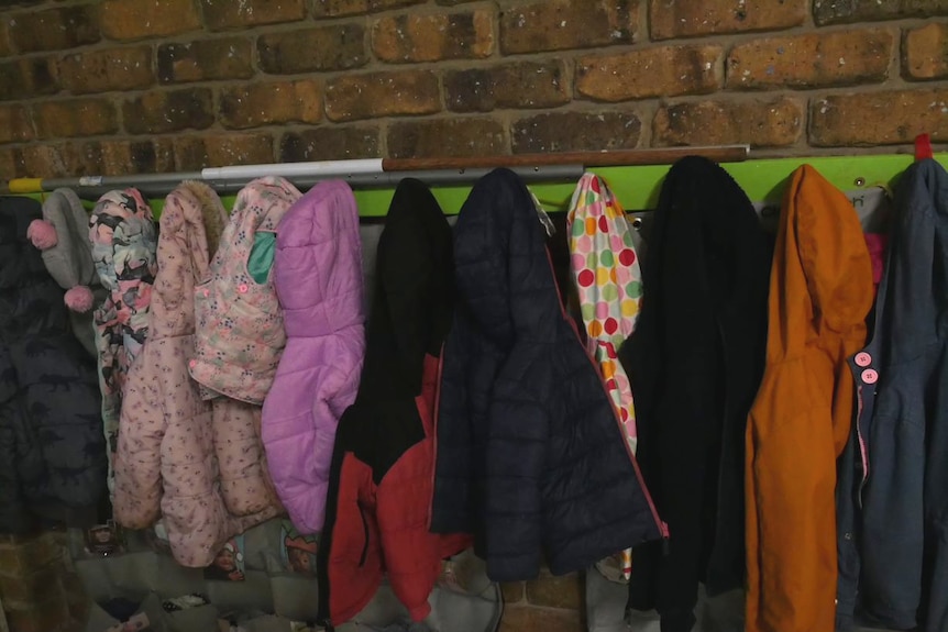 Children's winter coats hang on the coat rack in the toddler room at Naracoorte Early Learning Centre.