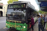 Passengers board an ACTION bus at the Civic interchange