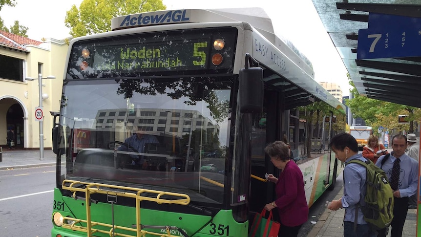 Passengers board an ACTION bus at the Civic interchange