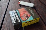 Cigarette packet and lighter