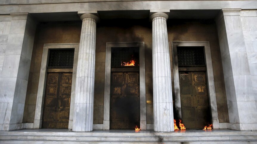 Fire caused by petrol bombs thrown by youths in Greece.