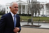 Malcolm Turnbull walks after speaking with journalists outside the White House.