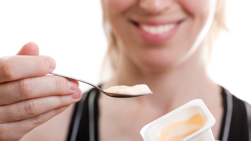 Woman eating yoghurt