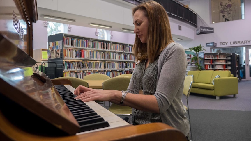 Jackie Gosling plays the piano at the Unley Library.