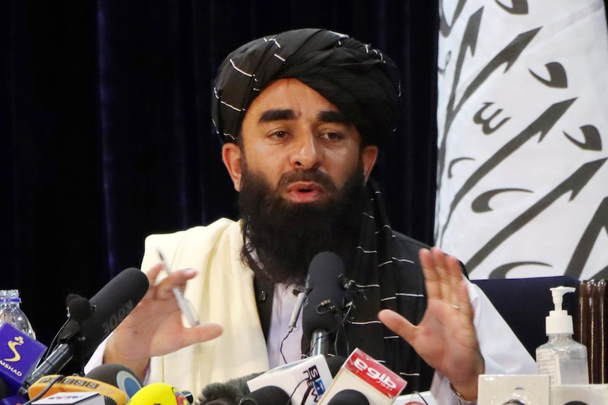  Zabihullah Mujahid speaks at a press conference.