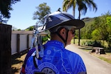 Silver tape attached to the back of a cyclist's helment
