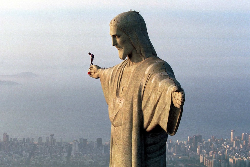 Felix Baumgartner prepares to jump from the arm of the Christ the Redeemer, overlooking Rio de Janeiro.