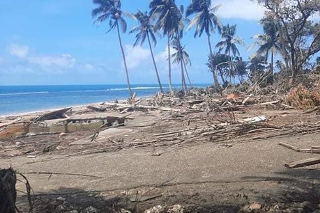 Ash-covered debris on the beach in Tonga.