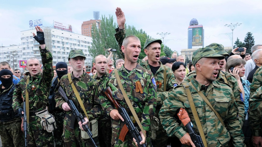 Pro-Russian militants take the military oath during the ceremony in Donetsk, Ukraine
