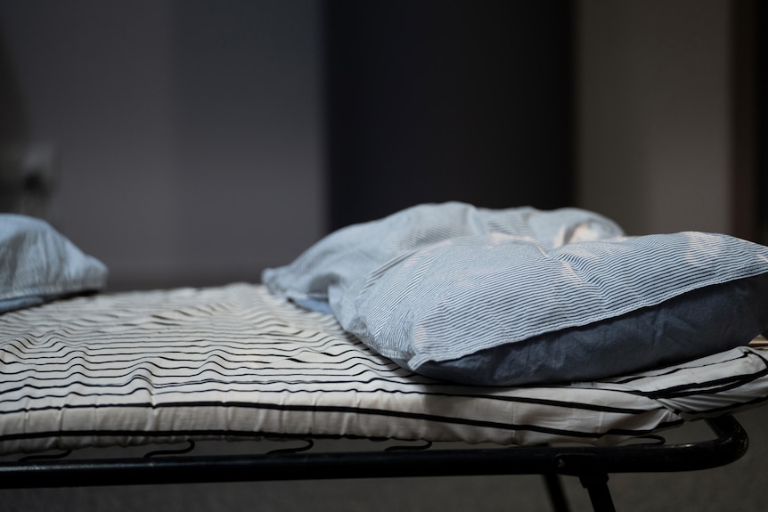 Pillow and bed in detention centre.