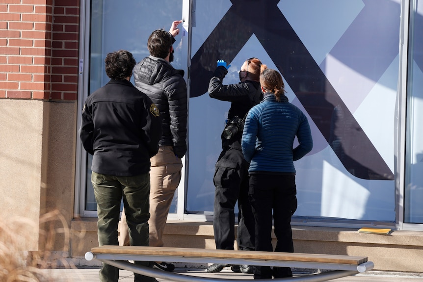 Investigators are finding evidence from a window frame outside an Xfinity store in Denver.