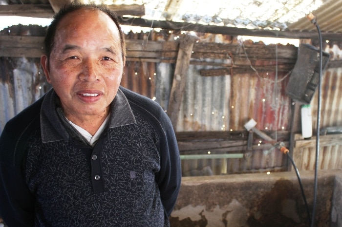 A man standing in a shed