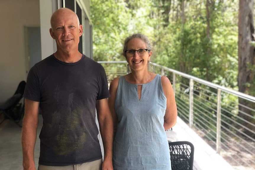 Owners of the Karri Fire House, Shauna and Michael Ausma, stand on their verandah.