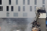 Rescue workers surround the CTV building in Christchurch