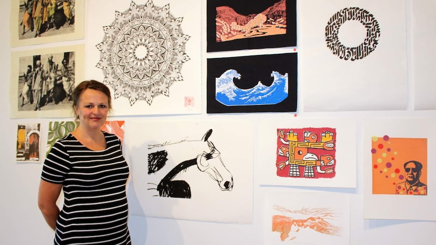 Megalo Print Studio and Gallery CEO/artistic director Ingeborg Hansen with an exhibition of members' works, Canberra, November2015.