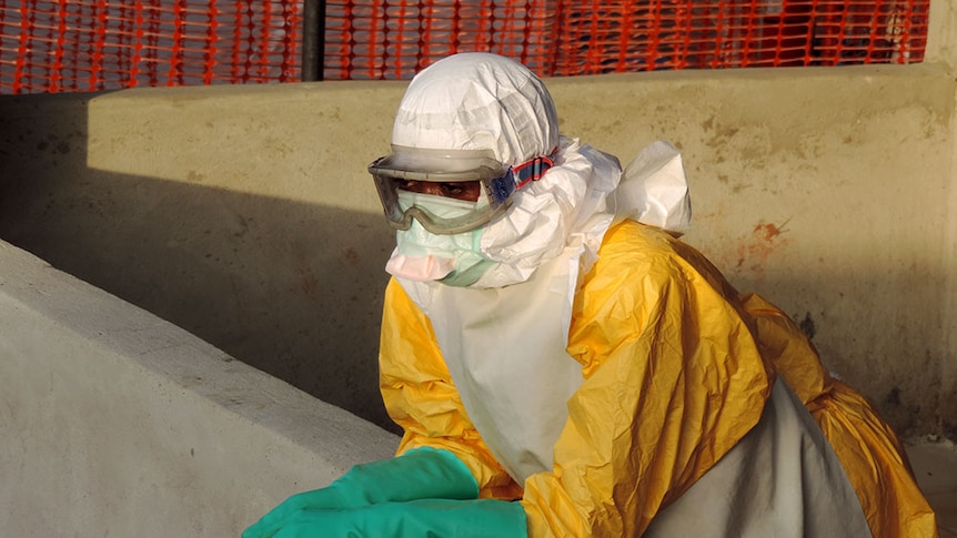 A volunteer, Sheku, awaiting decontamination for Ebola in Sierra Leone
