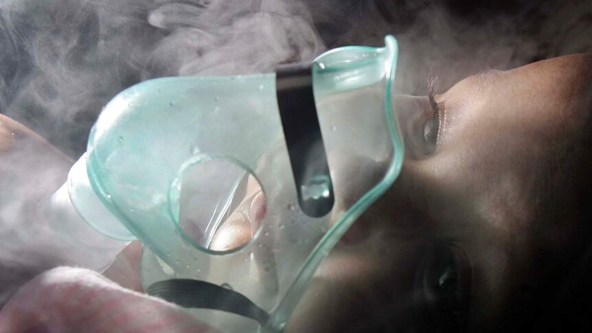 A girl with pneumonia is given oxygen treatment