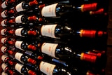 a full rack of red wine bottles