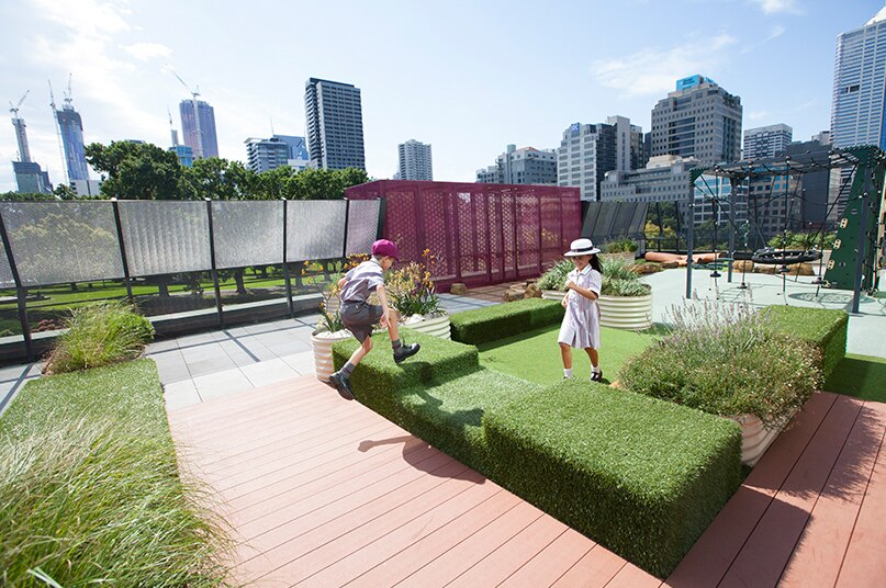 Children play on the roof of Haileybury College's 'vertical' campus in Melbourne's CBD.