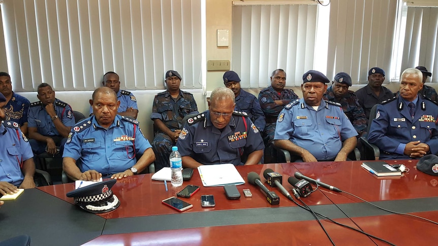 Police Commissioner Gari Baki (centre) surrounded by senior police officers. 