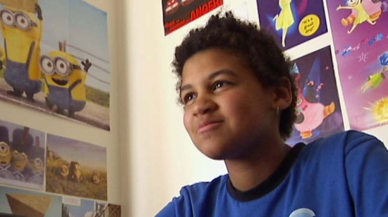 Jordan Purdy, Tasmanian school student sits on bed.