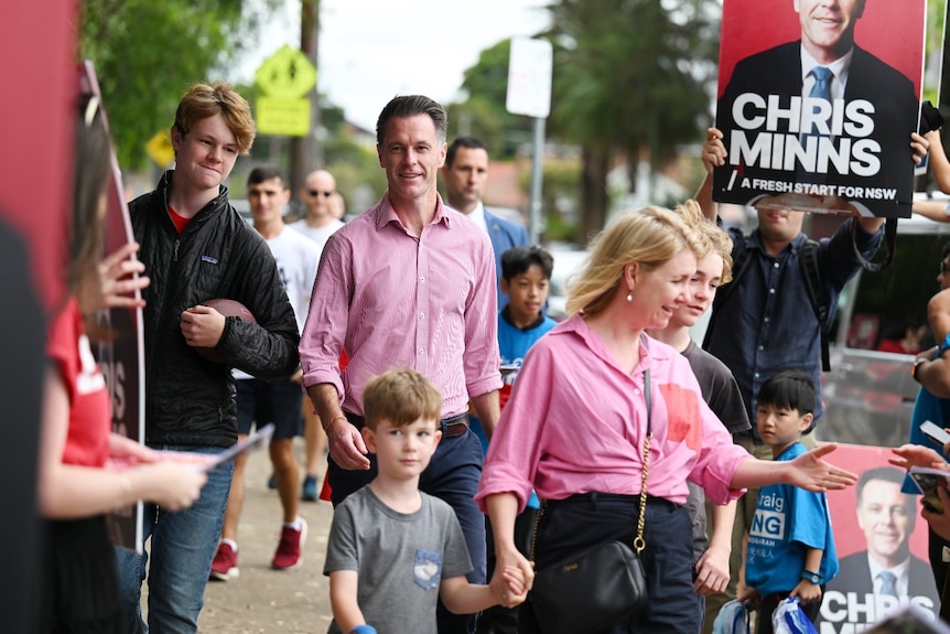 NSW Labor leader Chris Minns walks with his family