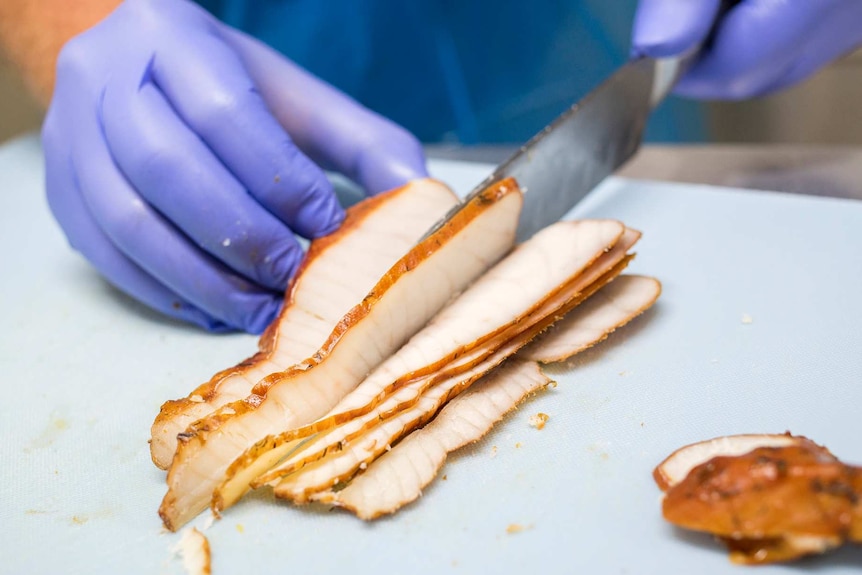 Slicing fish meat.