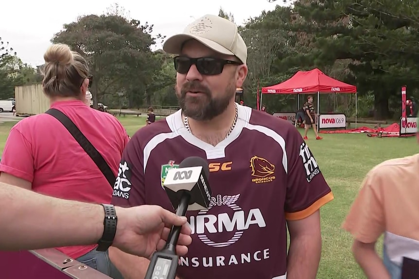 Broncos fan speaks into ABC microphone