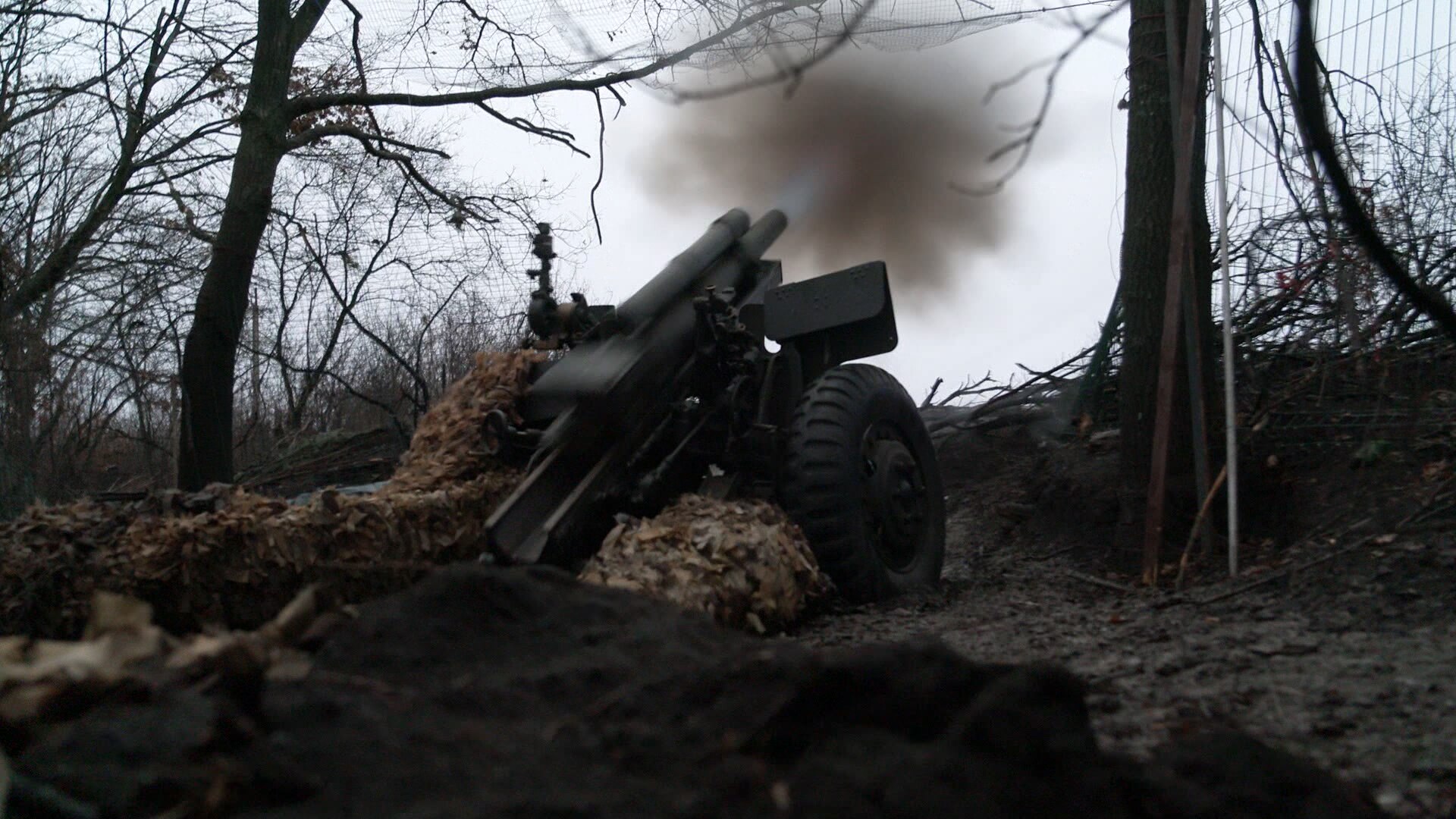 A shell is fired from an artillery weapon