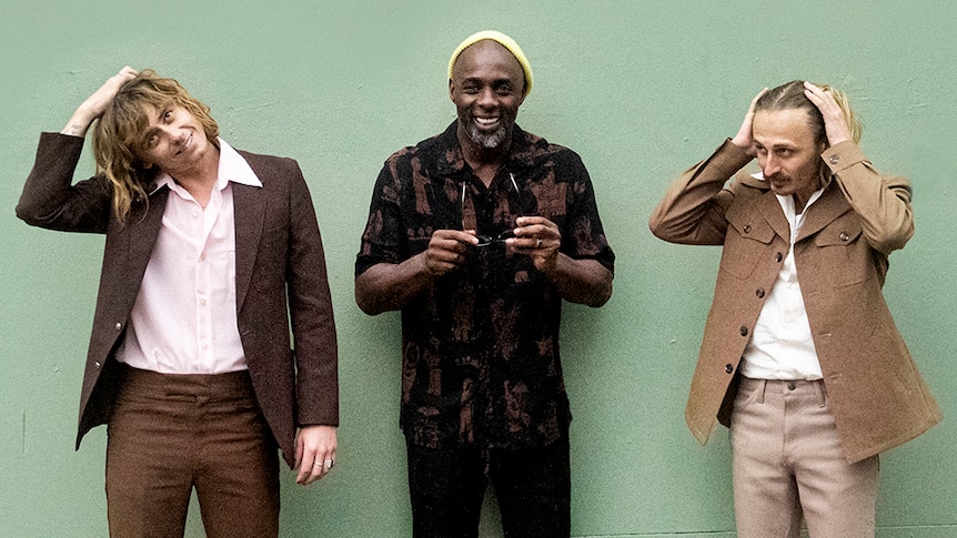 A 2021 press shot of Lime Cordiale with Idris Elba