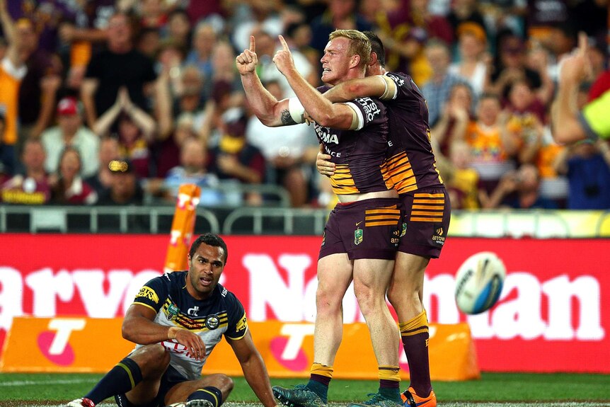 Reed celebrates his try for the Broncos