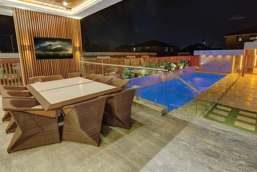 A table and swimming pool.
