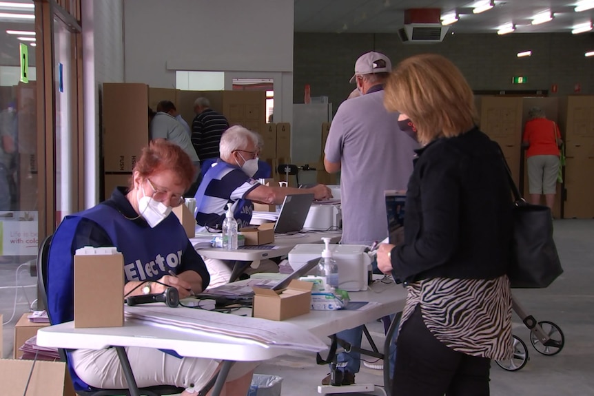 Pre-poll ballots are distributed in suburban Adelaide.